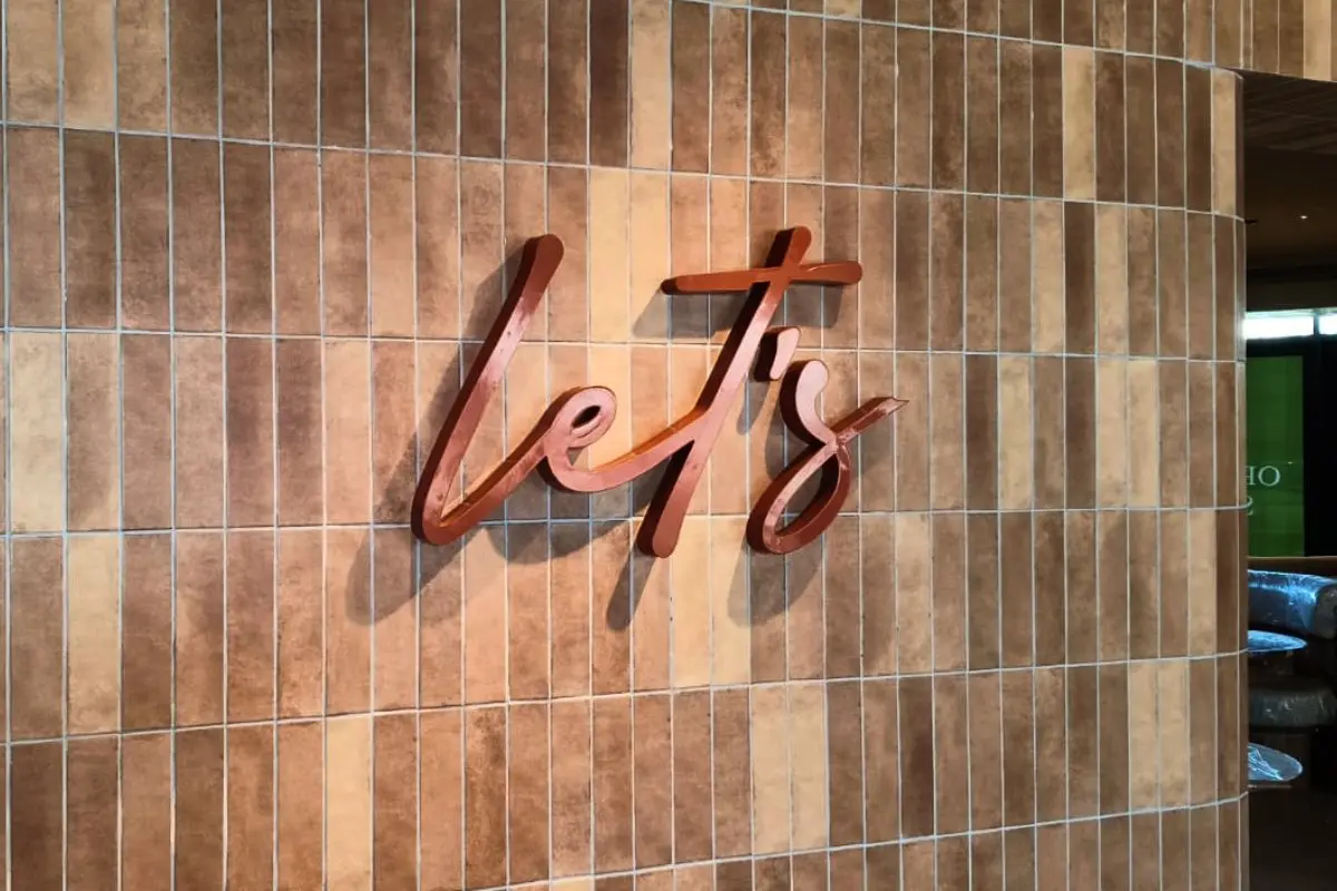 3d reception signage for lets cafe in al qana abu dahbi