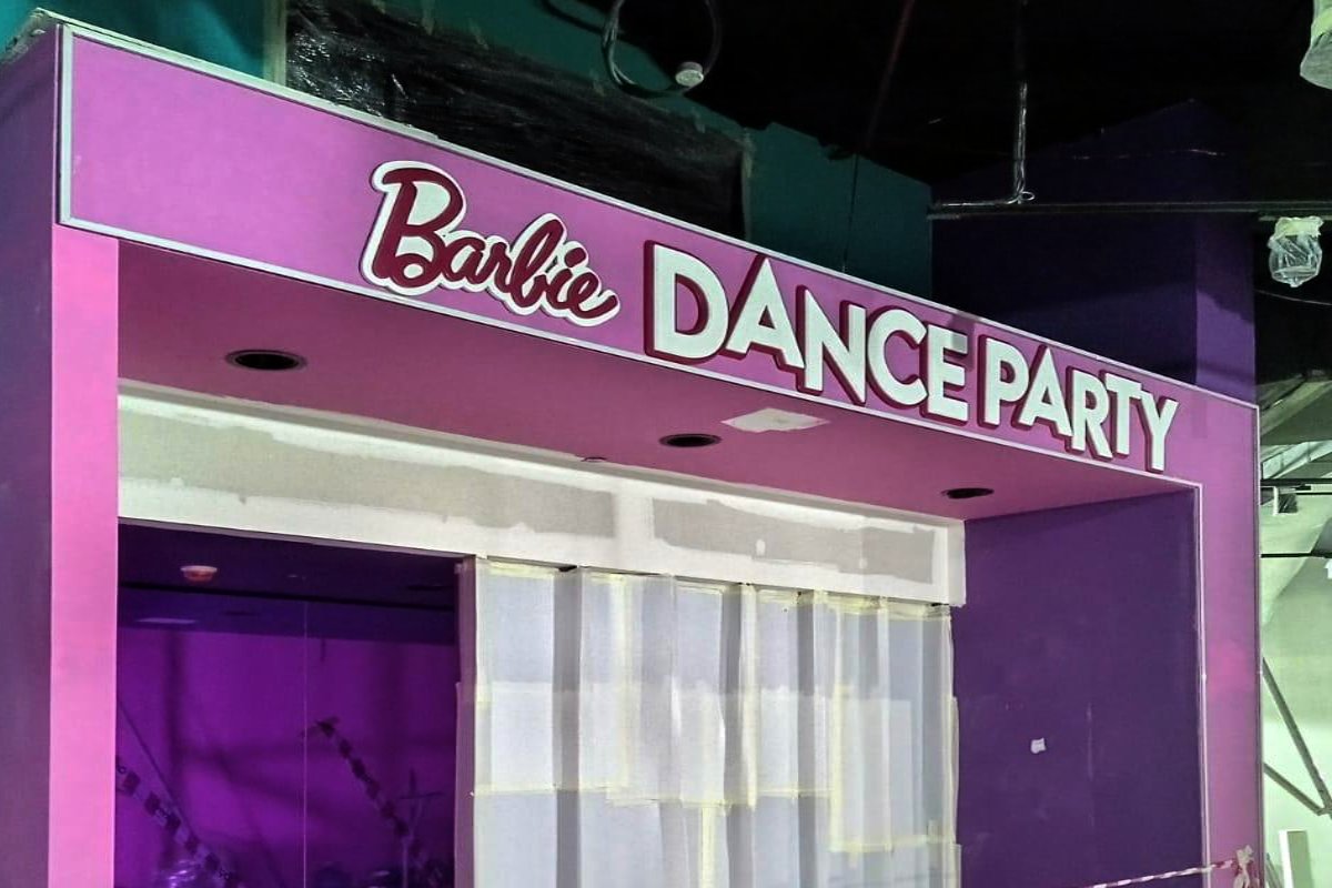 Barbie Dance Party themed signage installed at Mission Play by Mattel