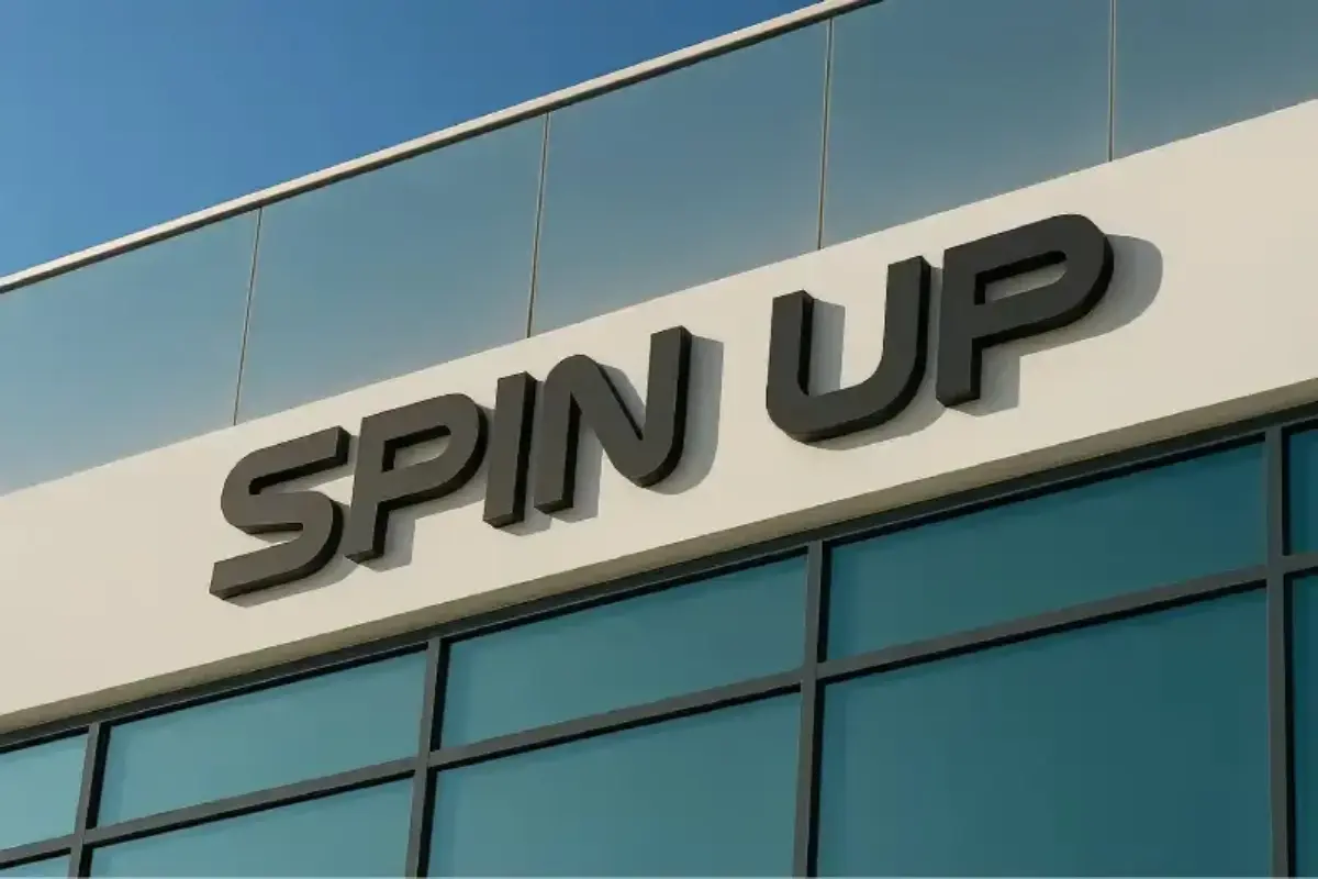 Professional signage installation in Abu Dhabi featuring a 3D signboard of Spin UP done By Ninety Nine Advertising LLC