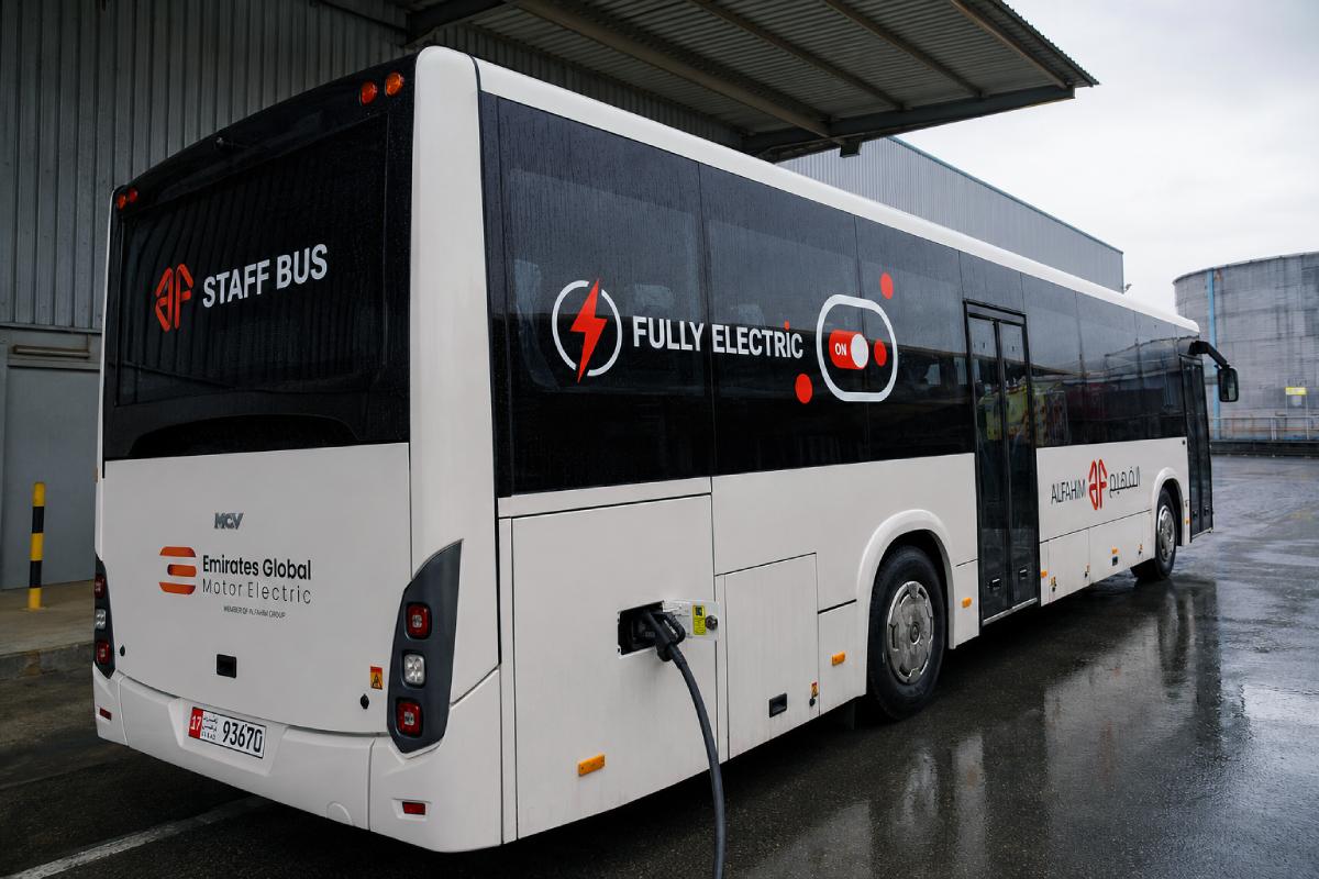 Bus vinyl cut lettering and decals, full side view, Abu Dhabi