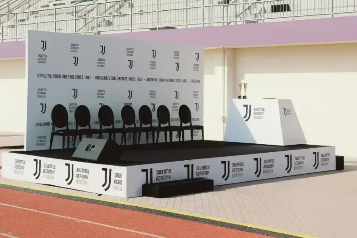 Juventus Academy Custom Stage setup with branded backdrop and podium for outdoor ceremonies in Abu Dhabi by Ninety Nine Advertising LLC.