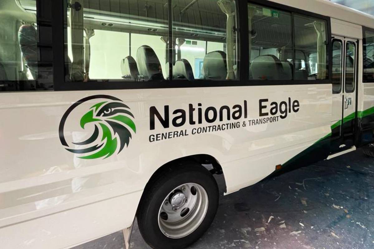 National Eagle bus branding and custom fleet vinyl cut lettering in Abu Dhabi