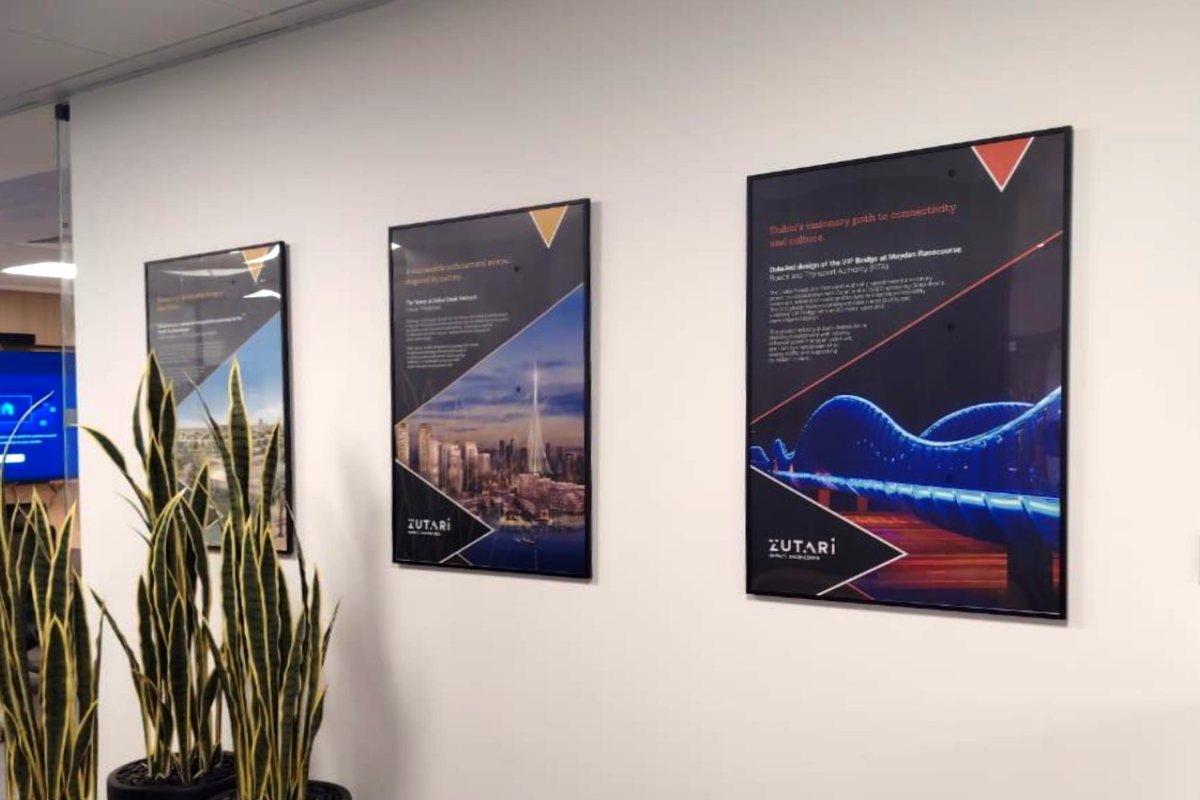 custom-black-framed-wall-art-displaying-engineering-projects-zutari-office-abu-dhabi-corniche