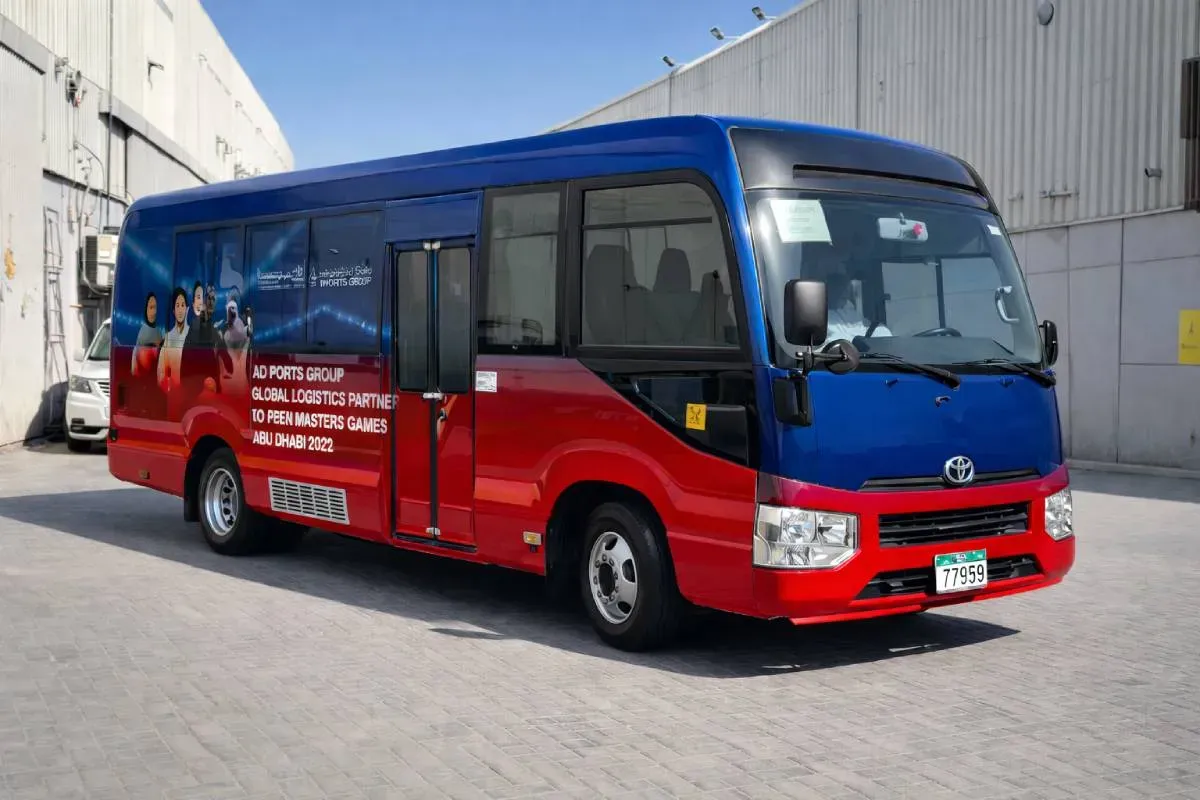 AD Ports Group bus branding featuring HP Latex cast vinyl graphics for International Masters Games Abu Dhabi.