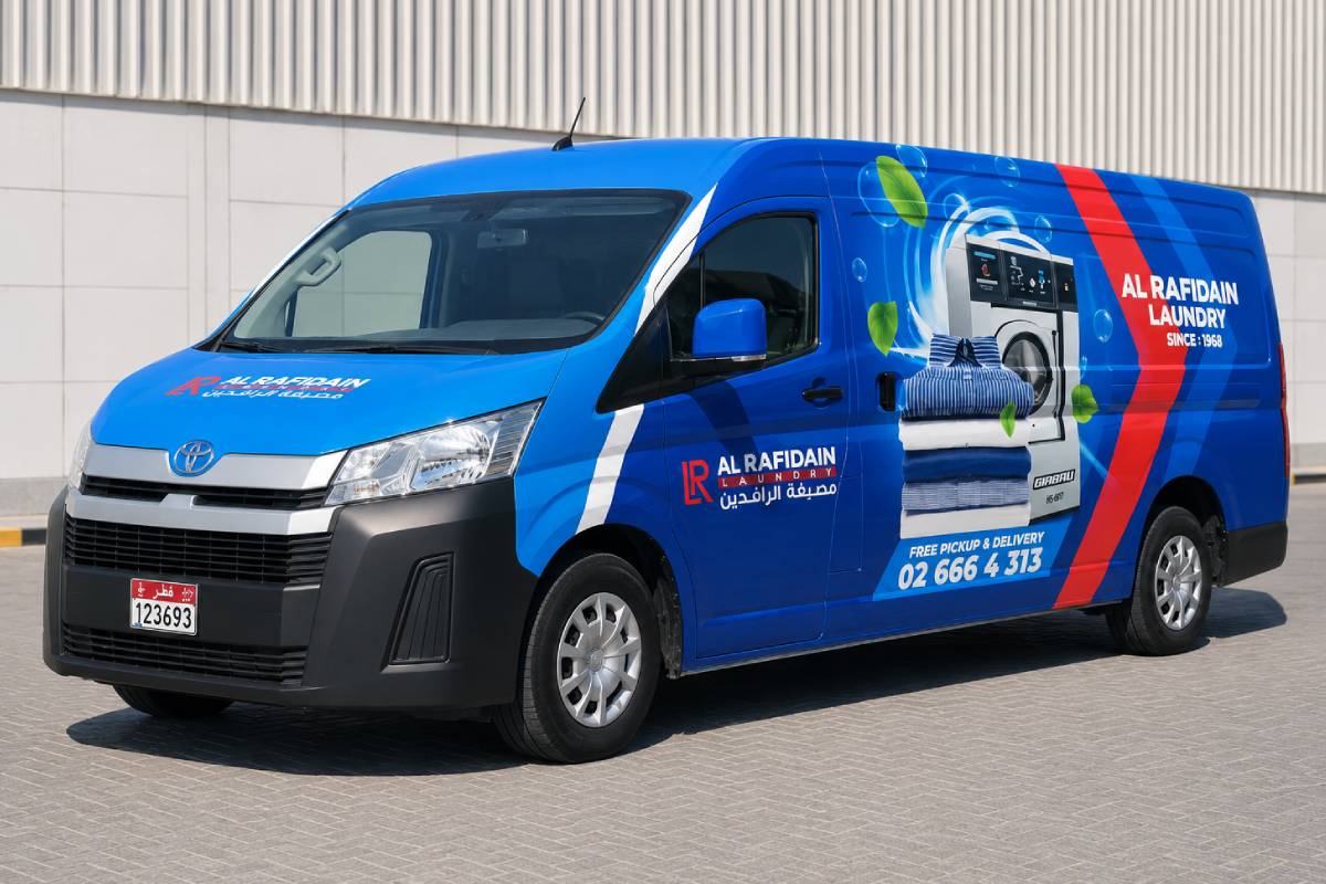 Full van branding on a Toyota HiAce laundry van in Abu Dhabi