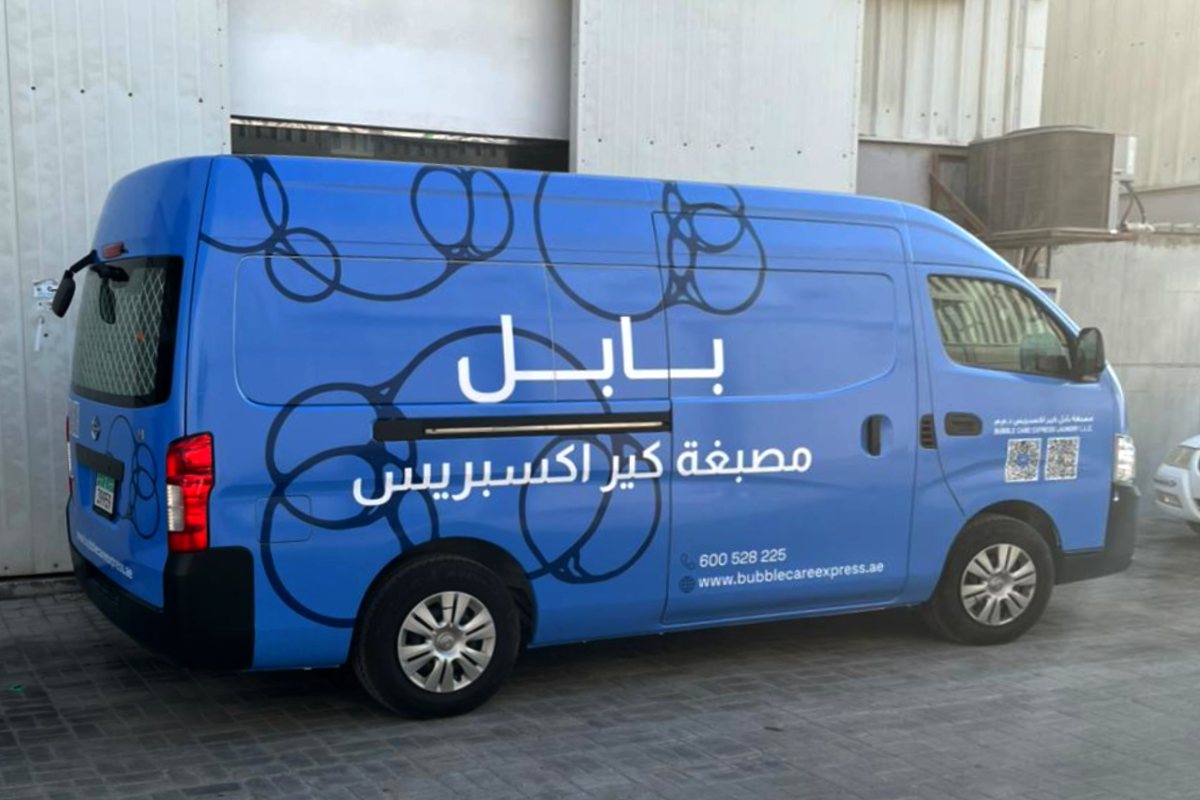 Bubble Care Express Laundry full branding on a high-roof Nissan Urvan in Abu Dhabi