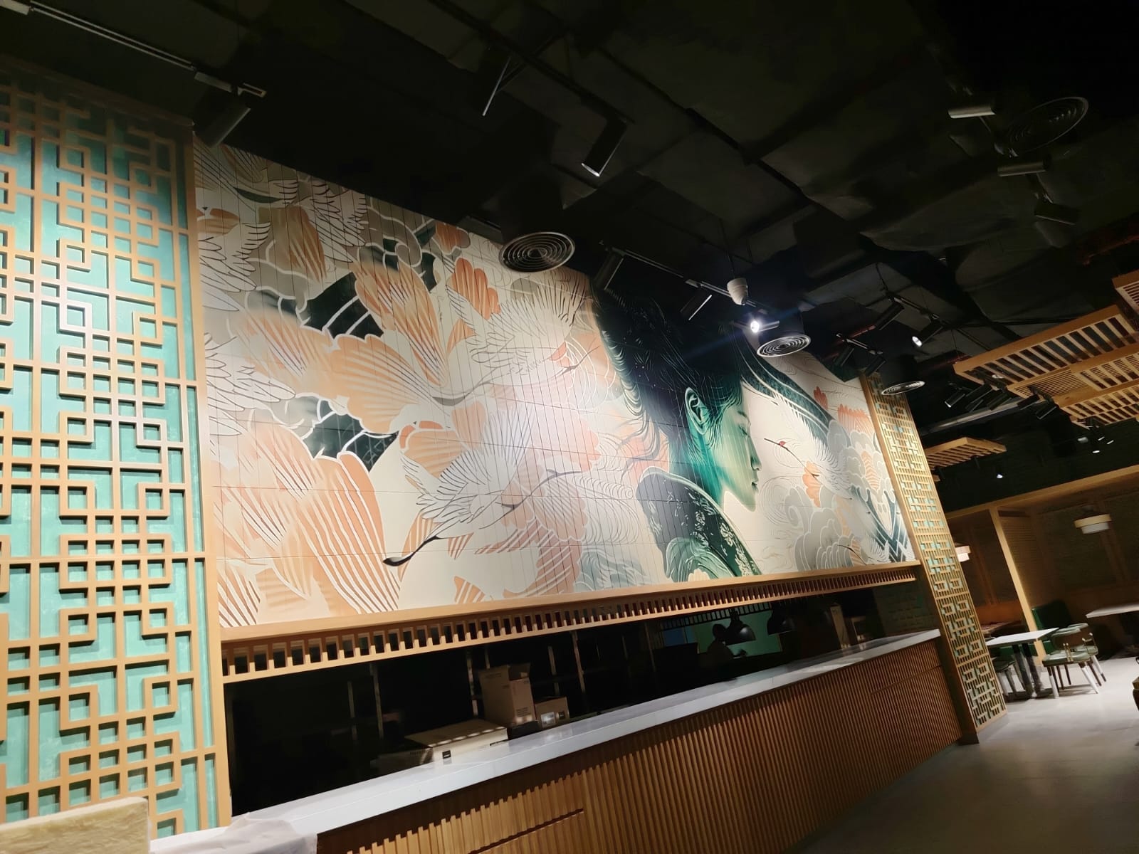 Golden Dragon printed mural across a tiled restaurant wall in Abu Dhabi