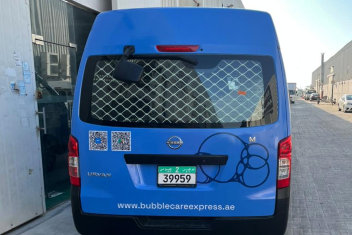 Rear panel branding with QR codes on a Bubble Care Express Laundry Nissan Urvan