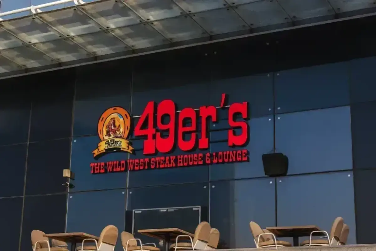 Professional signage installation in Abu Dhabi featuring a 3D signboard of 49er's SFC group done By Ninety Nine Advertising LLC