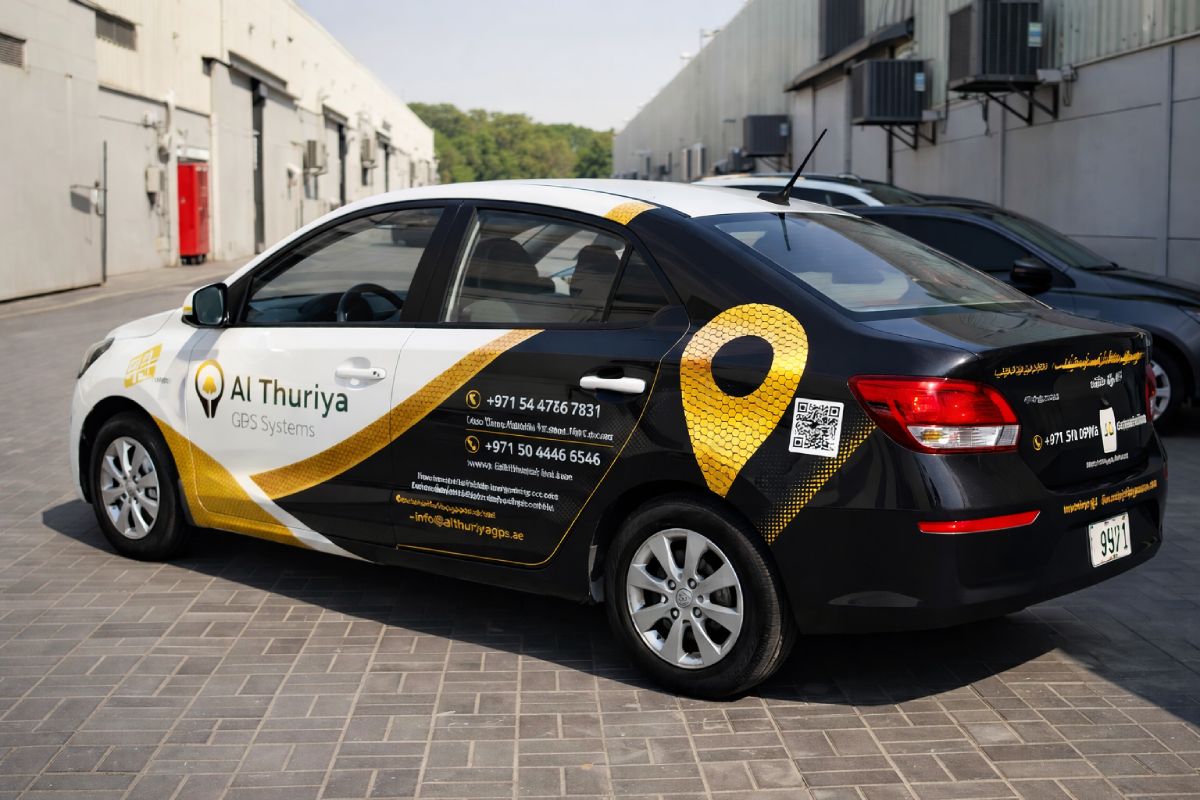 Reflective honeycomb graphics on an Al Thuriya GPS Systems sedan, Abu Dhabi