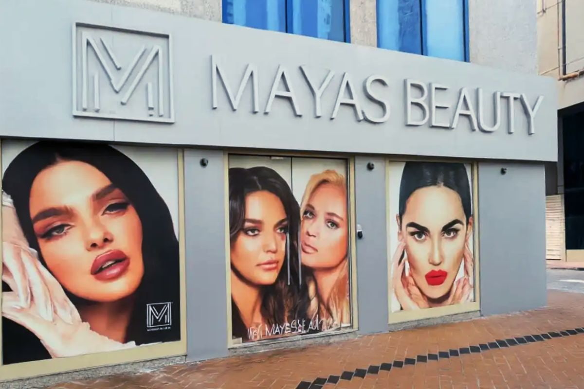 Mayas Beauty Opaque Window Graphics featuring high-res beauty portraits on a salon storefront on Khalifa St, Abu Dhabi by Ninety Nine Advertising LLC.