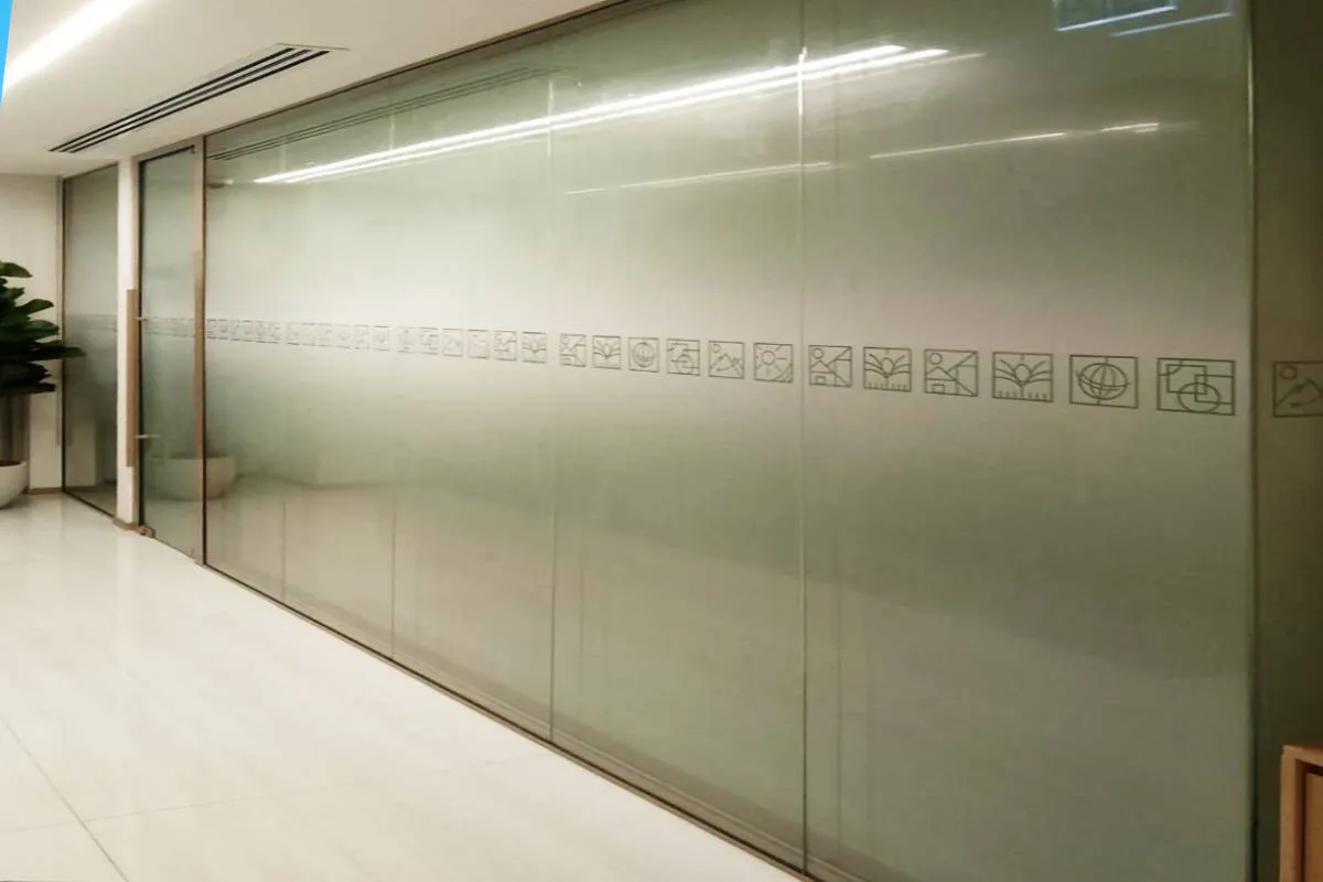 Custom frosted glass office branding and privacy film for the Emirates Council for Rural Development headquarters in Abu Dhabi.