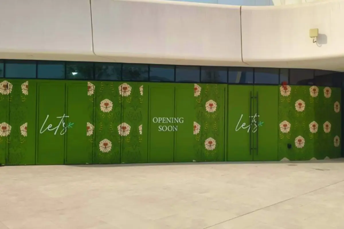 window branding using 100% opacity opaque printed sticker for lets cafe in Al qana abu dhabi wide view