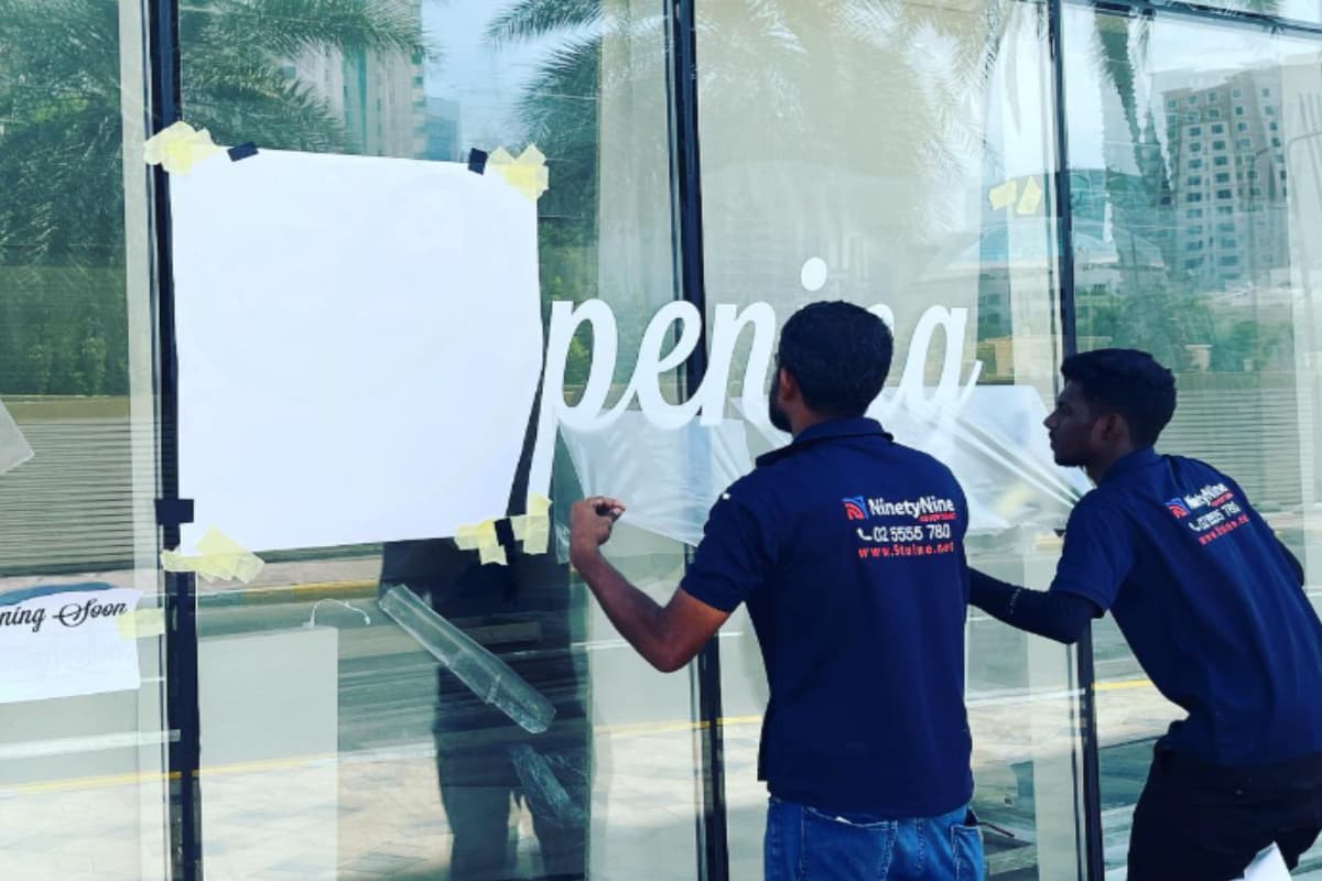 Opening-soon window lettering for a retail storefront